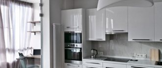 Interior of a white kitchen of 9 square meters with a balcony