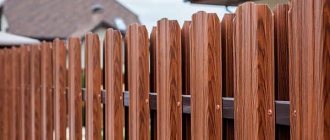 fencing the site with a metal picket fence