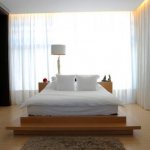 Modern bedroom with large window